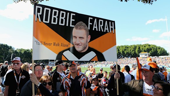 Departing son: The Robbie Farah faithful pay tribute to their hero.