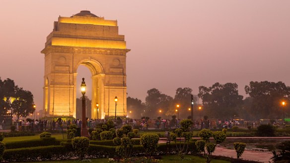 India Gate illuminated at twilight.