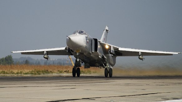 A Russian Su-24 takes off on a combat mission at Hemeimeem airbase in Syria in October.