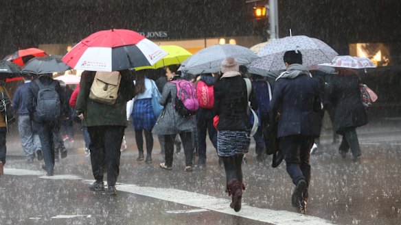 Workers brave the city on Wednesday.