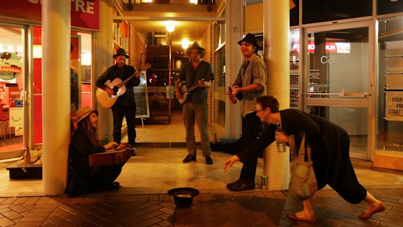 Giving money to other people, including buskers, makes you happy.