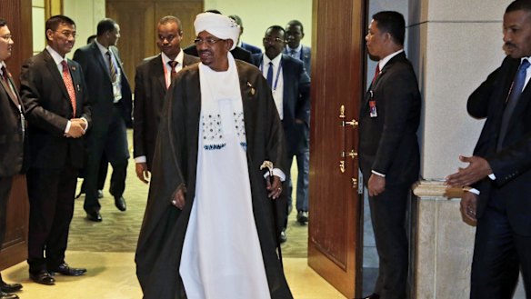 Sudan's President Omar al-Bashir leaves after a bilateral meeting with Indonesian President Joko Widodo on the sidelines of  the Organisation of Islamic Cooperation (OIC) summit in Jakarta. 