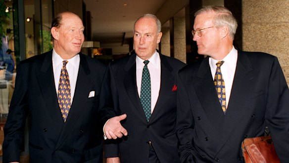 Kerry Packer (left), Bruce Gyngell (centre) and Brian Powers (right) leave the Publishing and Broadcasting Limited annual general meeting in 1996. 