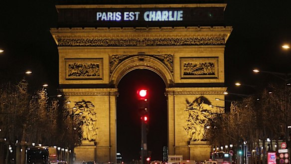 The message "Paris is Charlie" is projected on the Arc de Triomphe in Paris.