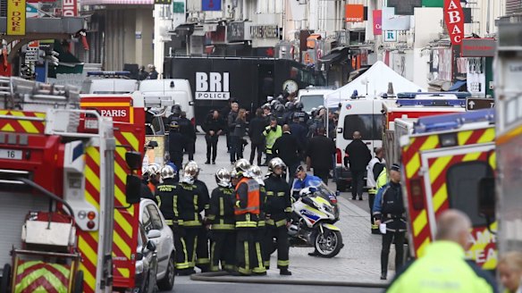 Military and police conduct an operation in Saint-Denis on Wednesday.