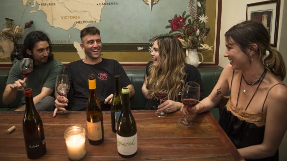 Cheers: Alistair Oliveria, Taylor Ferney, OliviaTravini and Rose Ashton enjoy an organic wine at The Unicorn hotel in Sydney.