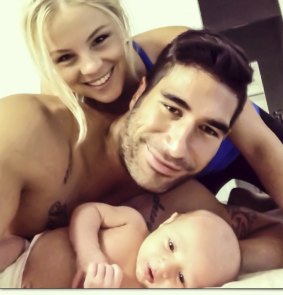 Family man: James Tamou with Brittney McGlone and their first child.