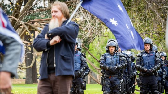 Victorian Special Operations Police members watch over members of the True Blue Crew at the Australian Pride March.