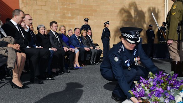 Assistant Commissioner Lauren Callaway lays a wreath on August 16, 2018 as family members, police and politicians gather to commemorate the lives of Gary Silk and Rodney Miller 20 years after they were killed.