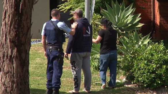A distraught friend or relative is comforted at the scene in Sturt Avenue on Tuesday.