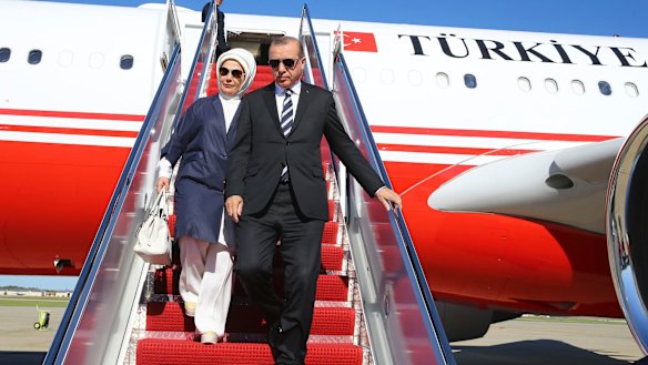 Turkey's President Recep Tayyip Erdogan and his wife Emine disembark from a plane after arriving in Washington.