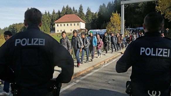 Refugees cross the border from Austria near Wegscheid in Germany on Wednesday. 