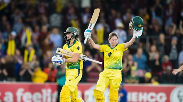 Beth Mooney acknowledges the crowd after hitting a century during the third T20 match at Manuka Oval in November.
