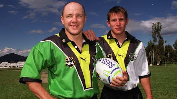 Andrew McFadden and Mark McLinden wear the new playing strips in 2000 at Parliament House.