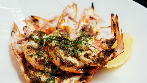 Close the deal over charcoal roast king prawns at Rockpool Bar & Grill.