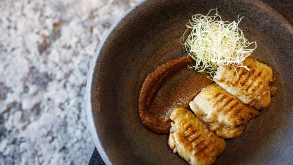 Tebasaki: Duck fat confit chicken wing with smoked miso butter.