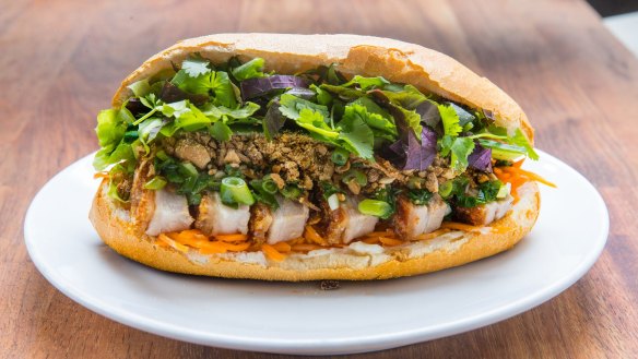 It's business as usual at Ca Com, the banh mi bar they opened last August. 