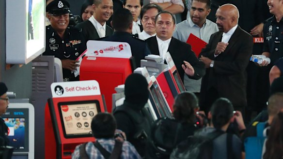 Malaysian deputy public prosecutor Muhammad Iskandar Ahmad, centre, visits the check-in kiosk at Kuala Lumpur International Airport on Tuesday.