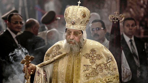 Egyptian Coptic Pope Tawadros II leads prayers during the Easter Eve service at St Mark's Cathedral in Cairo a week after the church was attacked.