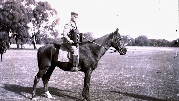 George Bell was the first Herald photographer. His heavy, full-plate camera was an added challenge on outback assignments. Photo taken in 1910.
