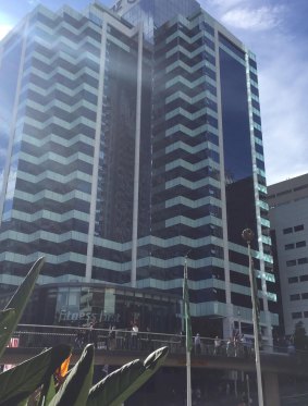 The panel hit the roof of the gym below, witnesses say.