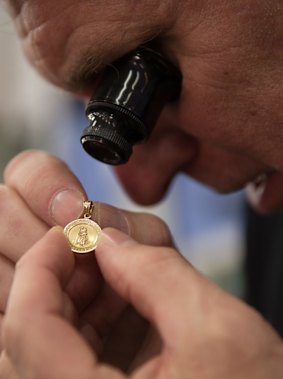 Hock 'n' Shop owner, Steve Perceval, examines some jewellery.