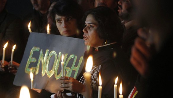 Pakistanis at a candlelit vigil in the nation's capital, Islamabad.
