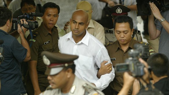 Myuran Sukumaran is escorted to court in Denpasar, Bali, in October 2005.