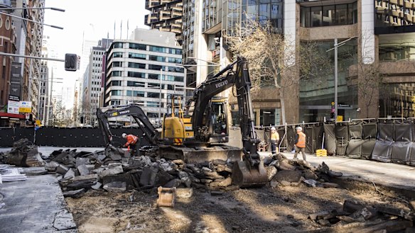 Diggers rip up roadway on the intersection of George, Bridge and Grosvenor streets in Sydney's CBD on Saturday.