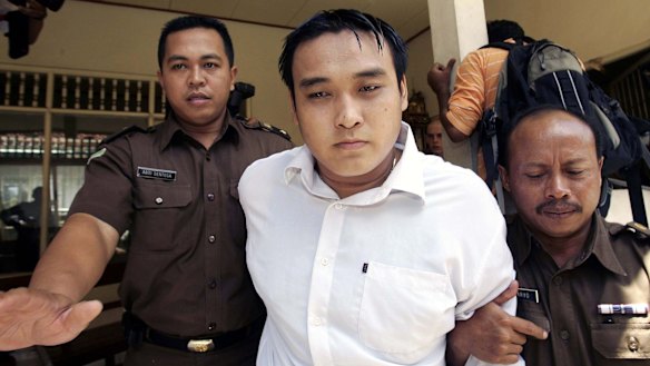 Australian Tan Duc Thanh Nguyen is led into a Denpasar courtroom during his trial for drug smuggling.