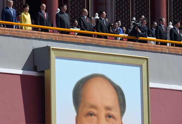 Over the watchful eyes of Mao: Xi Jinping, Park Geun-hye and Vladimir Putin review the troops.