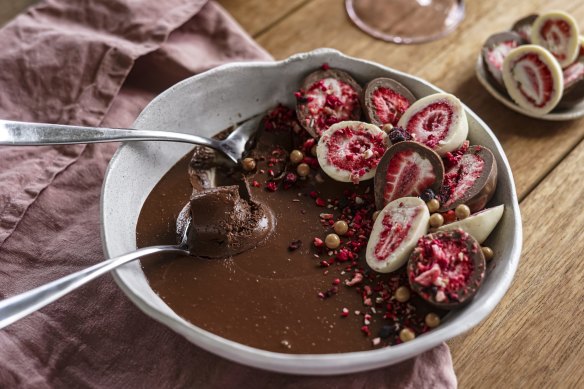 Chocolate mousse adorned with chocolate-covered freeze-dried berries.