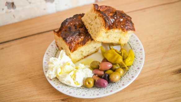 Focaccia served with olives, pickled chilli and torn burrata.