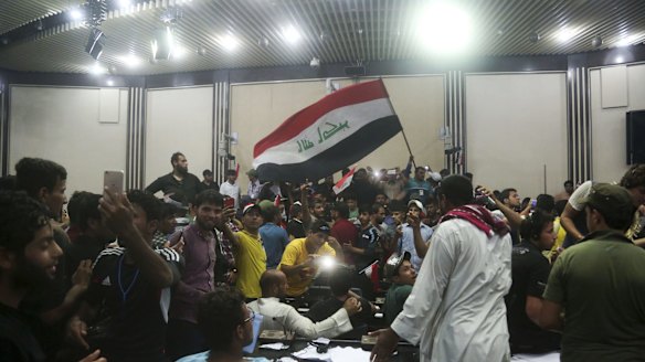 Supporters of Shiite cleric Muqtada al-Sadr storm parliament in Baghdad's Green Zone.