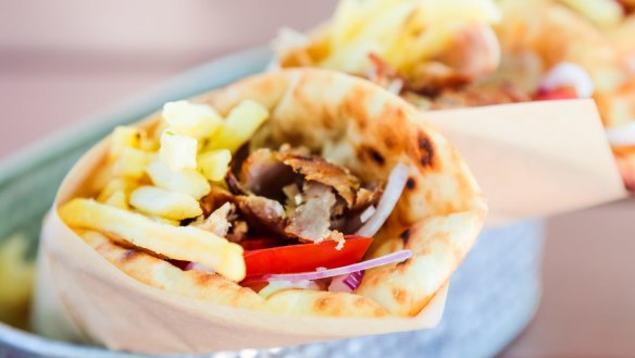 Portion of Gyros pita, traditional Greek fast food. Gyros Yiros pita generic?Stock image iStock