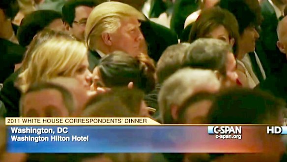 Butt of jokes: Donald Trump (centre left) listens at the 2011 White House Correspondents' Association dinner.