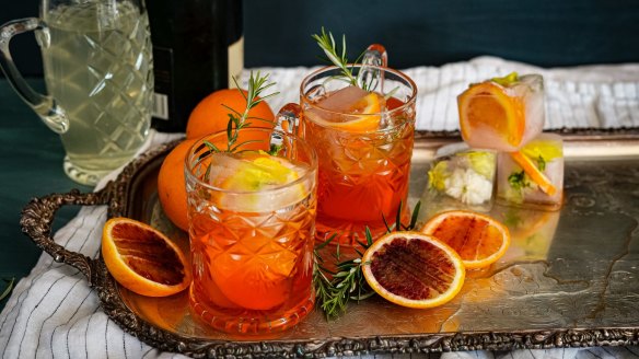 Aperol spritz with champagne and rosemary.