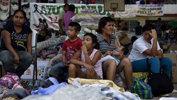Relatives and friends of the students remain at the Ayotzinapa school.