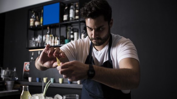 Bartender Michael Chiem mixes up some cocktails.