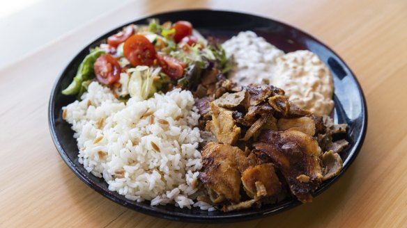 Doner kebab meal with rice and salad.