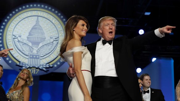 President Donald Trump acknowledges the crowd with first lady Melania Trump at the Freedom Ball. 