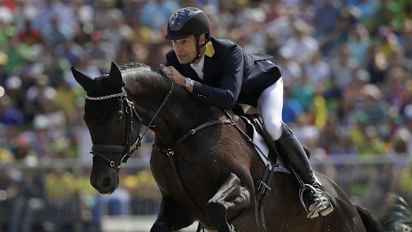 Chris Burton rides Santano II to clinch a team bronze medal for Australia in the equestrian
