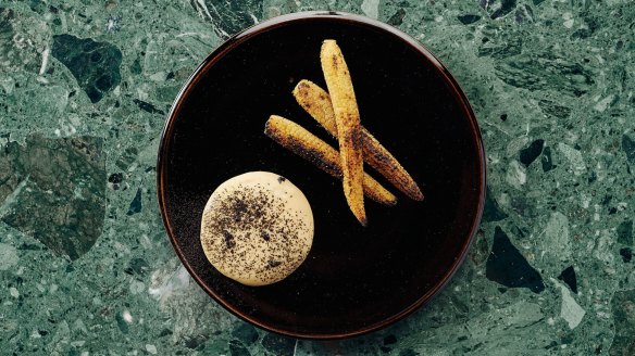 Cayenne-buttered baby corn with parmesan cream and black truffle.