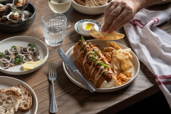 Curried fish finger roll with spicy pappadums at The Rover in Surry Hills.