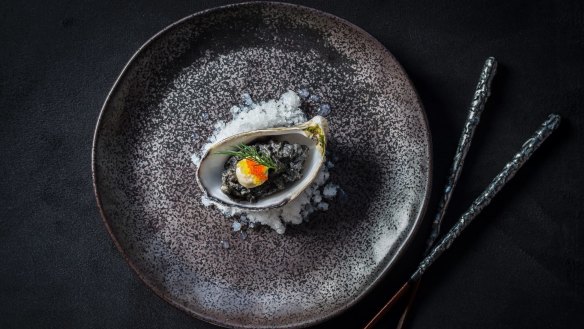 Blackened oyster with pickled ginger, umeboshi mayo and kimchi granita.