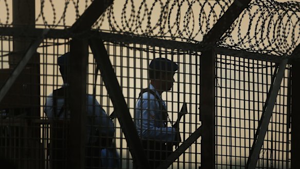 Indonesian police and a security guard.