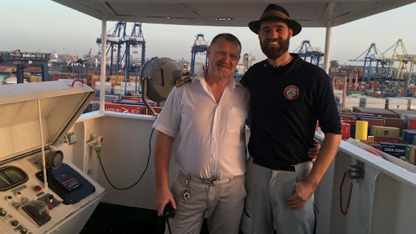 Thor Pedersen (right) aboard a cargo ship.