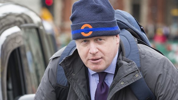 London mayor Boris Johnson rides his bicycle as he departs the Houses of Parliament on Monday.