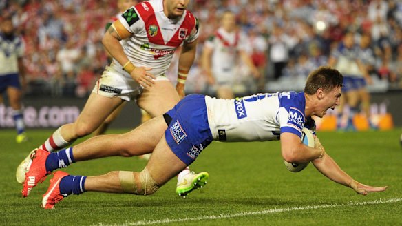 Try-time: Shaun Lane crosses for the Bulldogs.