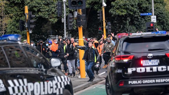 Protesters surround Police cars in the city. 